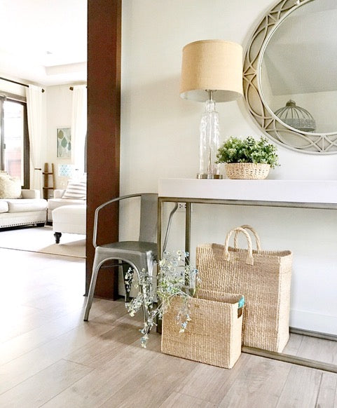modern organic home entryway with mirror and console handwoven baskets woven by artisans from sustainable plant fiber