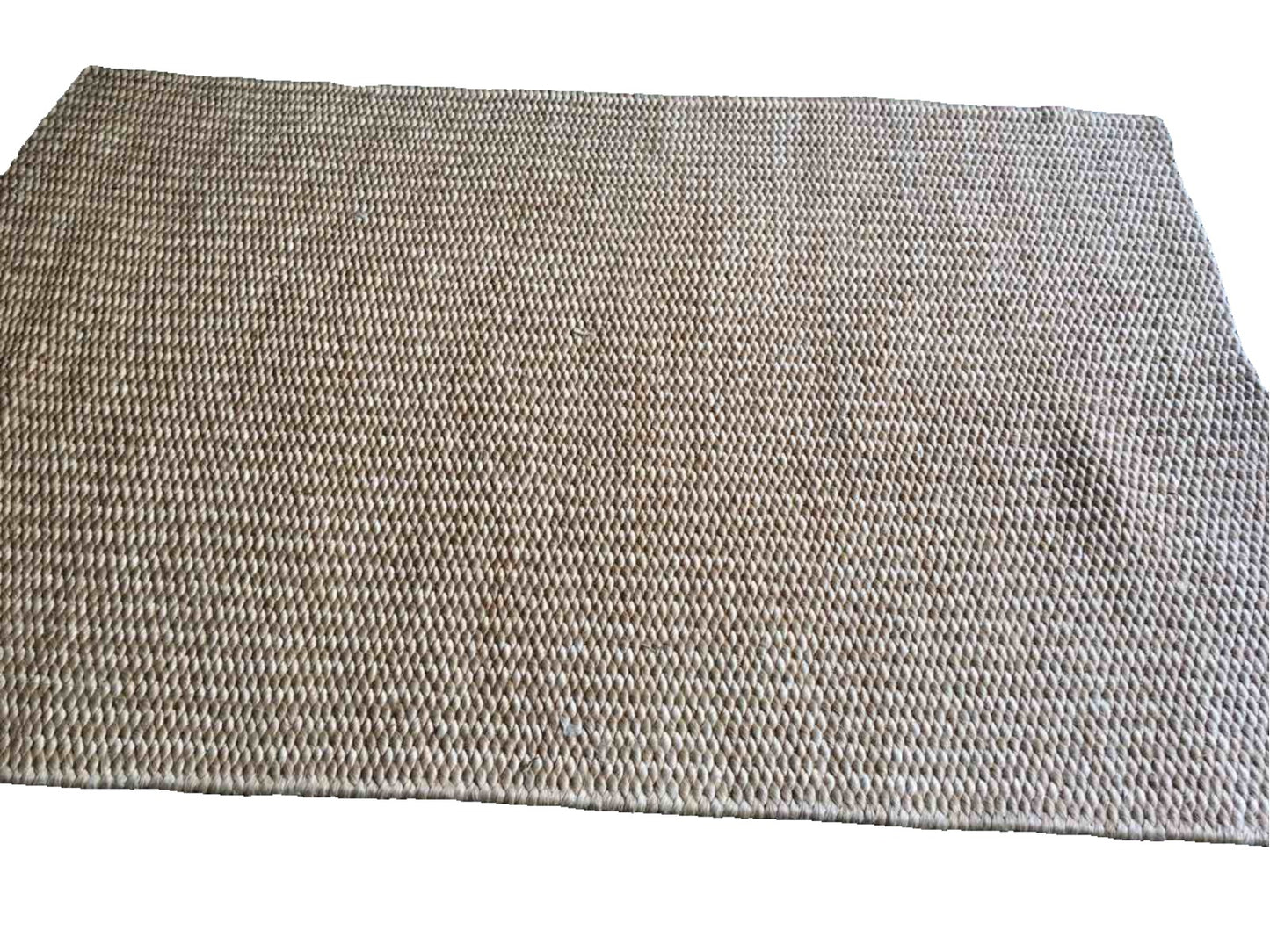 Elle Area Rug made from 100% natural plant fiber, perfect for adding texture and warmth to living rooms, bedrooms, and dining areas. Eco-friendly and versatile, it enhances a variety of home decor styles.