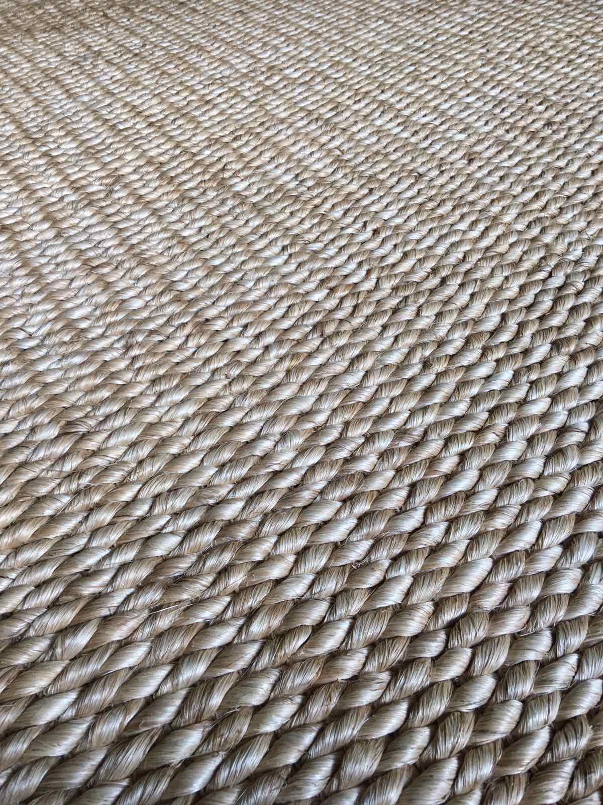 Elle Area Rug made from 100% natural plant fiber, perfect for adding texture and warmth to living rooms, bedrooms, and dining areas. Eco-friendly and versatile, it enhances a variety of home decor styles.