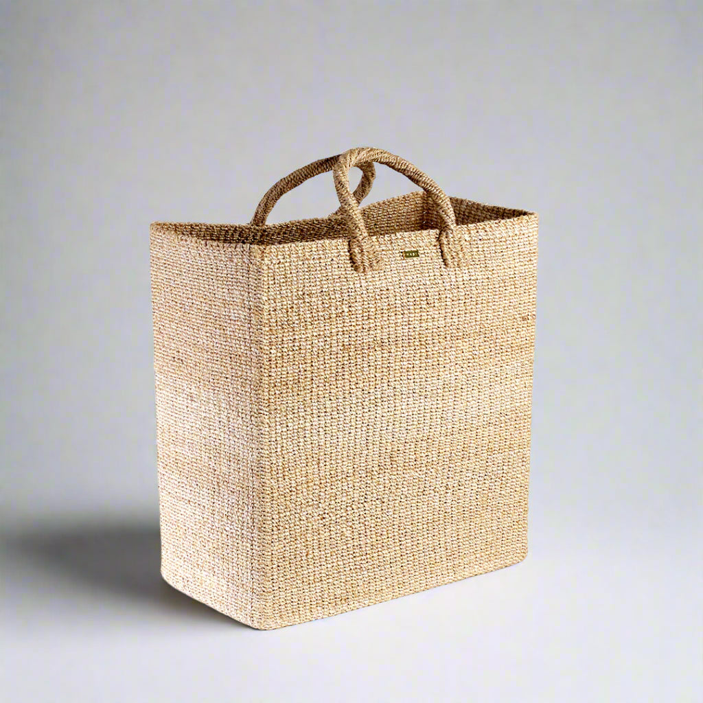 Keep your home organized with the Serene Rectangle Storage Basket. Handwoven from 100% natural plant fiber, this eco-friendly, stylish storage solution is perfect for laundry, sports gear, or seasonal items.