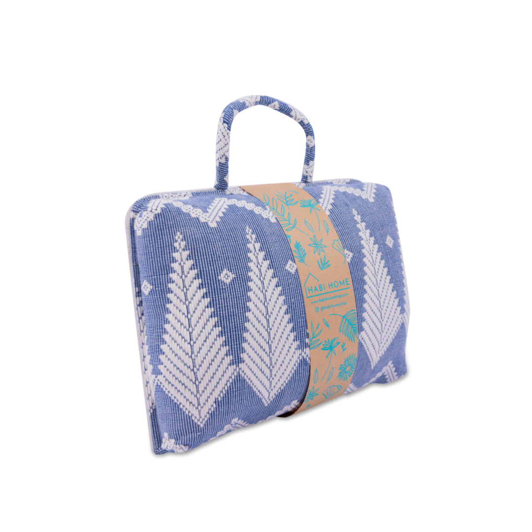 Handwoven Hazel Laptop Pillow Blue Feather made from Abel Iloco fabric, featuring geometric patterns inspired by nature, offering comfort and cultural heritage with a soft, durable design perfect for home or office use.