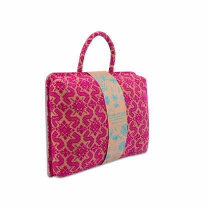 Handwoven Hazel Laptop Pillow Pink Patterns made from Abel Iloco fabric, featuring geometric patterns inspired by nature, offering comfort and cultural heritage with a soft, durable design perfect for home or office use.