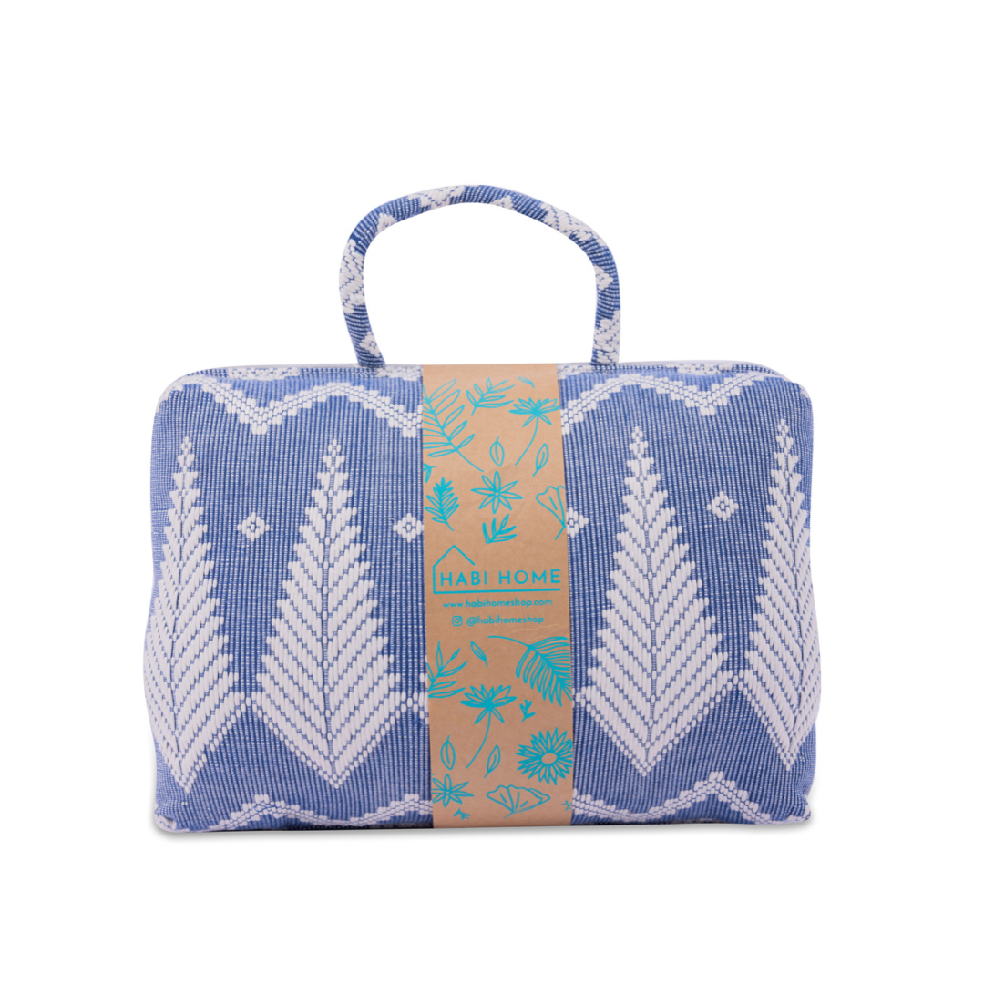 Handwoven Hazel Laptop Pillow Blue Feather made from Abel Iloco fabric, featuring geometric patterns inspired by nature, offering comfort and cultural heritage with a soft, durable design perfect for home or office use.