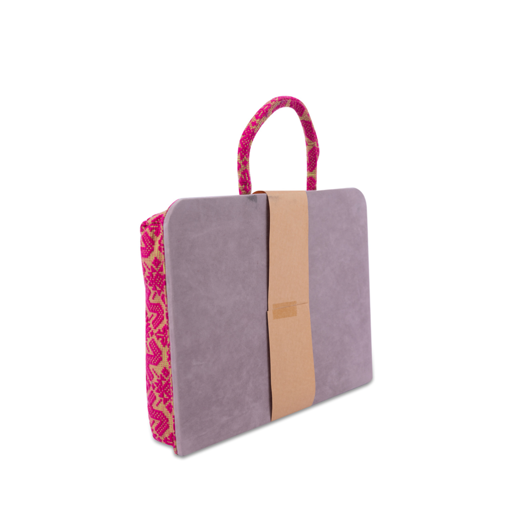 Handwoven Hazel Laptop Pillow Pink Patterns made from Abel Iloco fabric, featuring geometric patterns inspired by nature, offering comfort and cultural heritage with a soft, durable design perfect for home or office use.