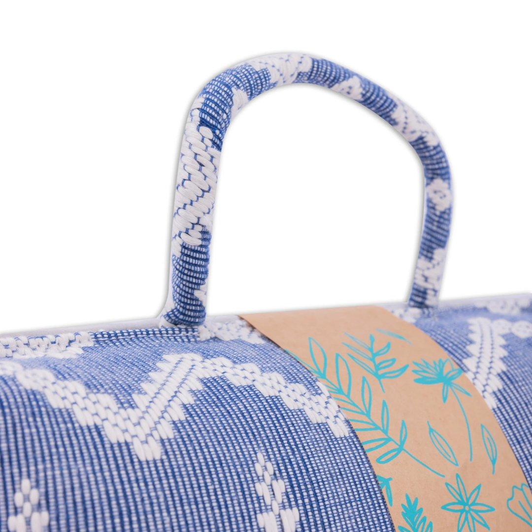 Handwoven Hazel Laptop Pillow Blue Feather made from Abel Iloco fabric, featuring geometric patterns inspired by nature, offering comfort and cultural heritage with a soft, durable design perfect for home or office use.