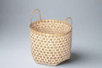 Faustina Nude Festive Star Laundry Hamper crafted from 100% natural plant fiber, featuring a celestial star motif that transforms a functional item into a decorative accent. Durable and eco-friendly, this hamper enhances your living space while supporting sustainable craftsmanship.