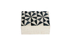 Store your jewelry in style with the Penelope Geometric Triangles Embroidery Jewelry Box. Made from eco-friendly materials and featuring intricate embroidery, this sustainable box combines function and elegance for your vanity or dresser.