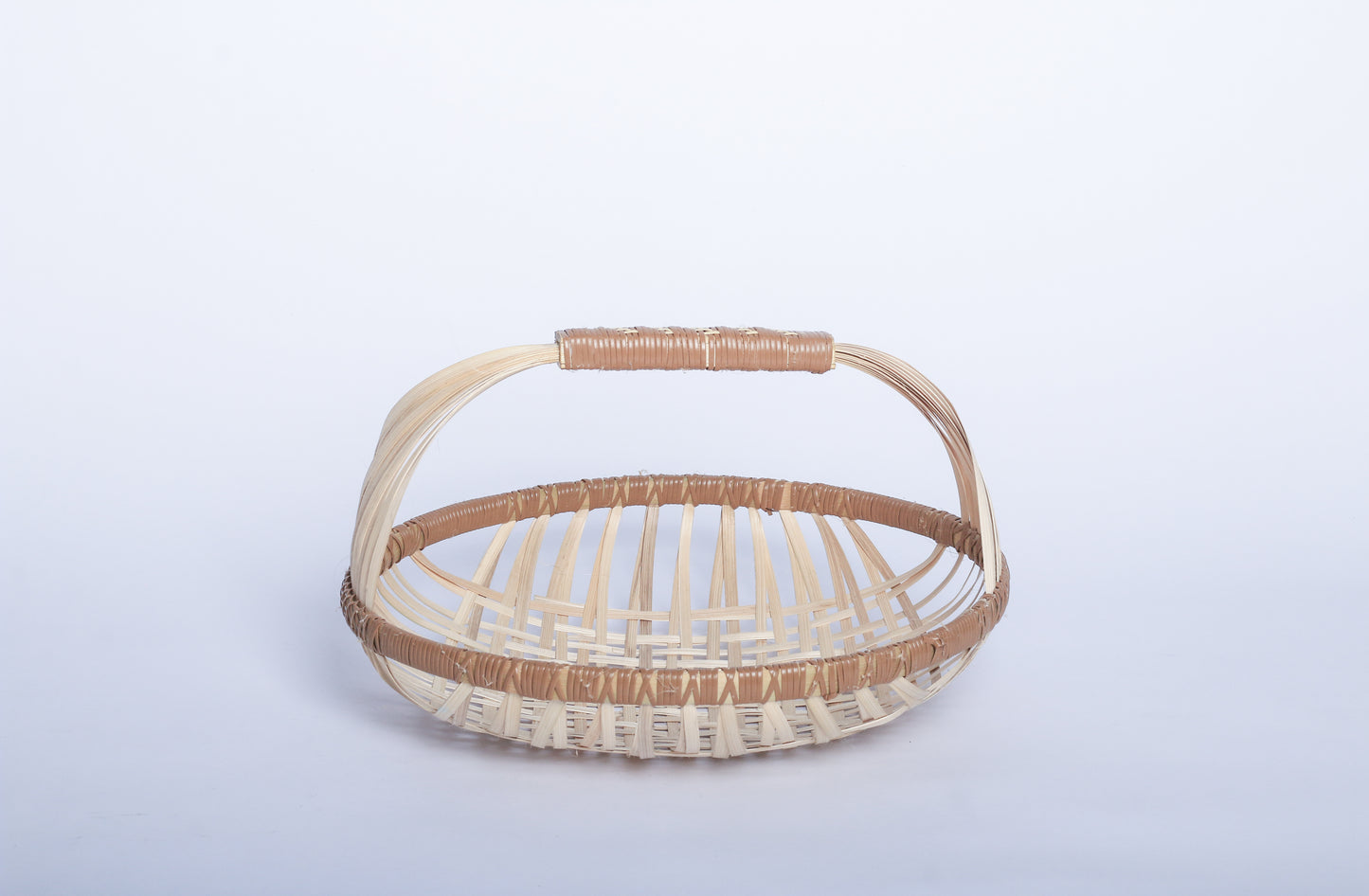 Plain Pale Faustina Festive Fruit Basket with Handle, crafted from eco-friendly materials, perfect for carrying fresh produce, organizing kitchen essentials, or adding a decorative touch to your home. Features a sturdy handle and vibrant design for culinary adventures.
