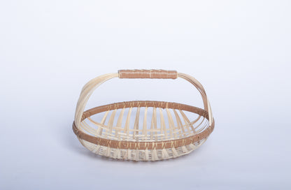 Plain Pale Faustina Festive Fruit Basket with Handle, crafted from eco-friendly materials, perfect for carrying fresh produce, organizing kitchen essentials, or adding a decorative touch to your home. Features a sturdy handle and vibrant design for culinary adventures.