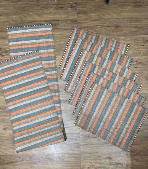 Abi Table Runner and Placemat Set of 6 in Earth, handcrafted from 100% natural plant fiber, featuring rustic tones and sustainable elegance.