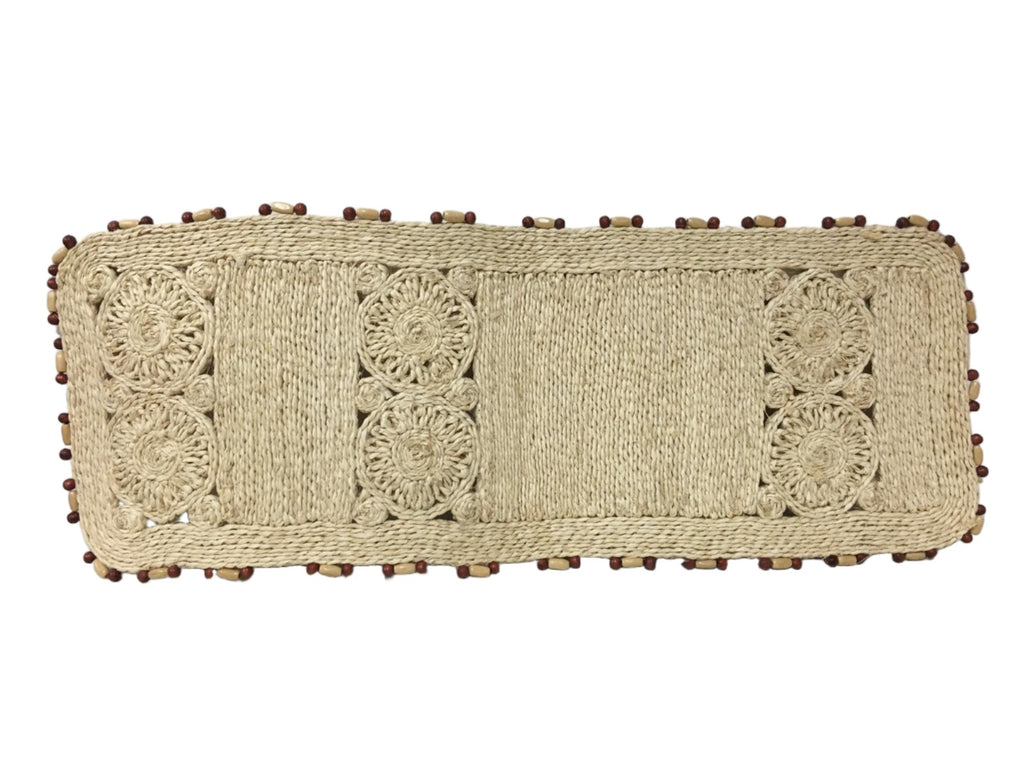 Add sustainable elegance to your home with the Anna Long Centerpiece Mat in Bleach. Perfect for centerpieces, buffets, or plant displays, made from 100% natural plant fiber.
