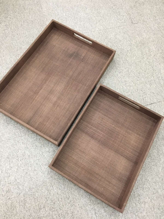Zoey Decorative Trays Set of 2 in brown, made from natural plant fiber, perfect for organizing and serving with rustic charm.