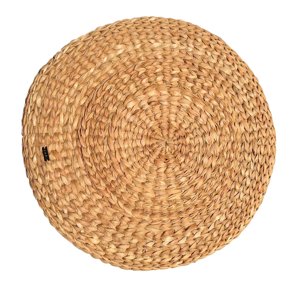 Carol Round Seagrass Pillow, a multifunctional home decor piece made from sustainably sourced seagrass, featuring a textured design that adds natural elegance to various styles like bohemian and modern coastal. Perfect for adding comfort to rattan benches or casual lounging on the floor, this eye-catching pillow enhances any living space while sparking conversations among guests. Care instructions include avoiding moisture and spot cleaning with a damp cloth.