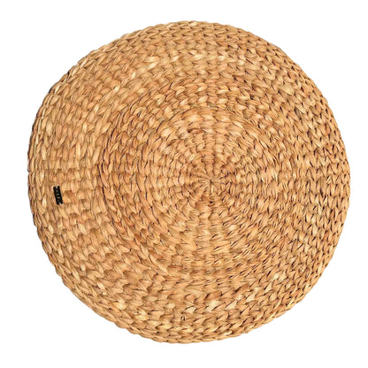 Carol Round Seagrass Pillow, a multifunctional home decor piece made from sustainably sourced seagrass, featuring a textured design that adds natural elegance to various styles like bohemian and modern coastal. Perfect for adding comfort to rattan benches or casual lounging on the floor, this eye-catching pillow enhances any living space while sparking conversations among guests. Care instructions include avoiding moisture and spot cleaning with a damp cloth.