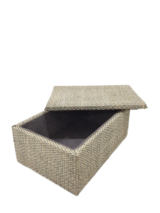 Cheska Jewelry Box in Grey, expertly crafted from 100% natural plant fiber using traditional raffia weaving techniques. This handwoven jewelry box combines elegance and functionality, making it perfect for organizing cherished jewelry, keepsakes, and knick-knacks. The soft grey hue adds a modern touch, complementing various decor styles from bohemian to contemporary. Ideal for sustainable living, this beautifully crafted jewelry box showcases artisanal skill while maintaining a timeless design. Care instruc