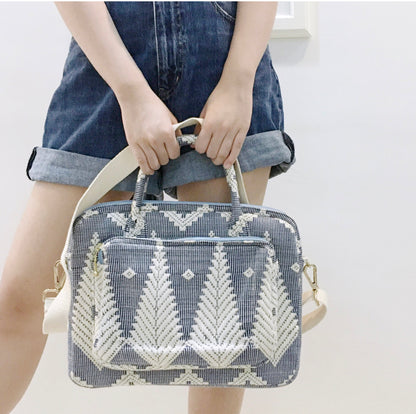 Dani Inabel Laptop Bag, handwoven from Abel Iloco fabric in the Philippines, showcasing intricate geometric patterns inspired by nature. This eco-friendly laptop bag blends traditional craftsmanship and functionality, crafted by skilled Ilocos artisans using centuries-old weaving techniques. Made with 50% cotton and 50% polyester, the bag offers durability with a removable, adjustable cotton strap. Ideal for work, school, or casual outings, this laptop bag supports sustainable living and Filipino heritage. 