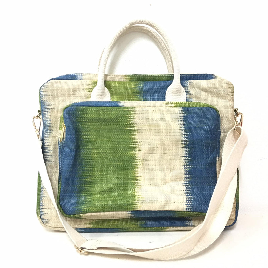Deidre Green Pasture T'nalak Laptop Bag made from traditional T'nalak fabric, handwoven by the Tboli tribe in Mindanao using sustainable abaca plant fiber. This eco-friendly laptop bag accommodates devices up to 14 inches, blending heritage and modern utility with adjustable cotton straps. Durable 50% polyester and 50% cotton body. Spot clean for best care.