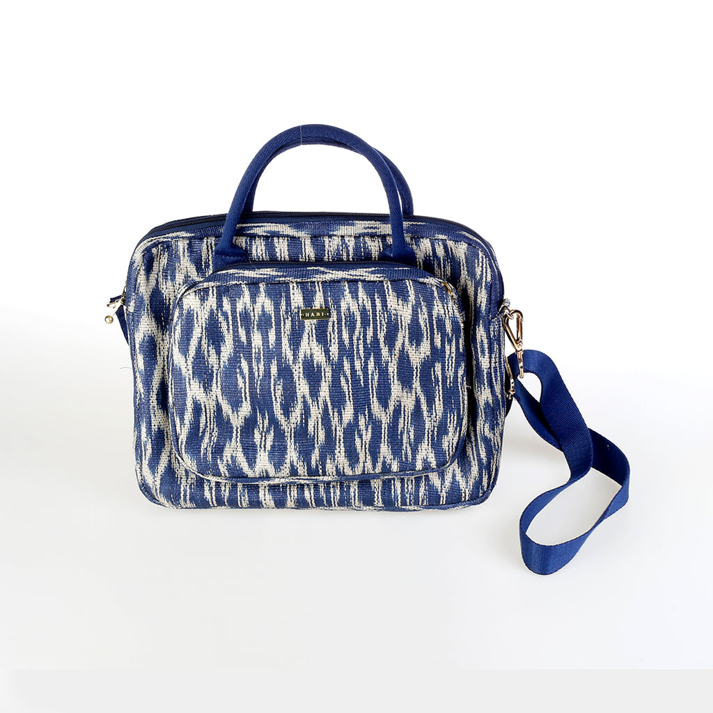 Deidre T'nalak Laptop Bag made from traditional T'nalak fabric, handwoven by the Tboli tribe in Mindanao using sustainable abaca plant fiber. This eco-friendly laptop bag accommodates devices up to 14 inches, blending heritage and modern utility with adjustable cotton straps. Durable 50% polyester and 50% cotton body. Spot clean for best care.