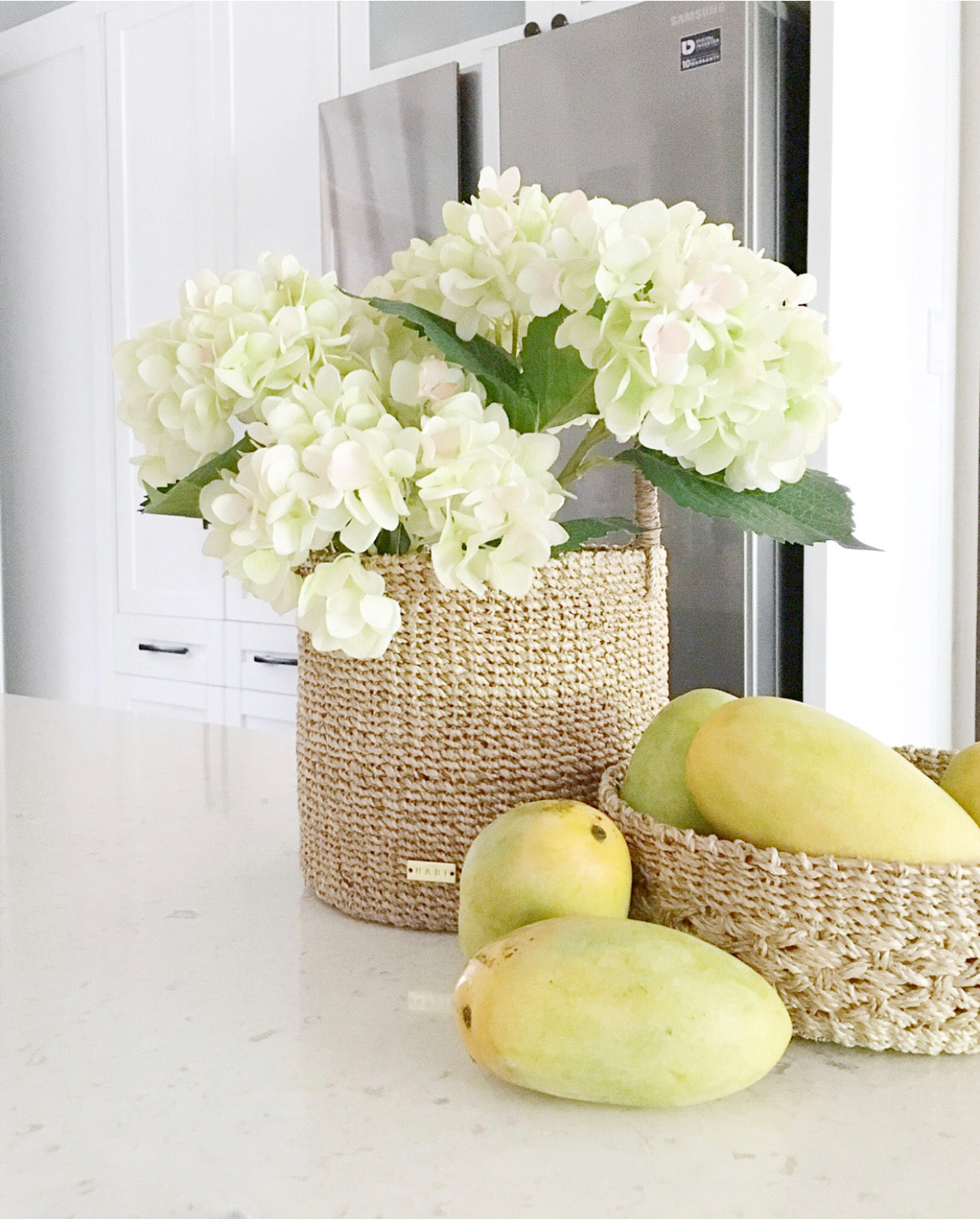 Dinah Catch All Basket made from 100% natural plant fiber, perfect for organizing essentials like keys, condiments, bath items, and vanity accessories. Versatile storage basket for entryways, kitchens, and bathrooms, adding charm and eco-friendly functionality to any space.