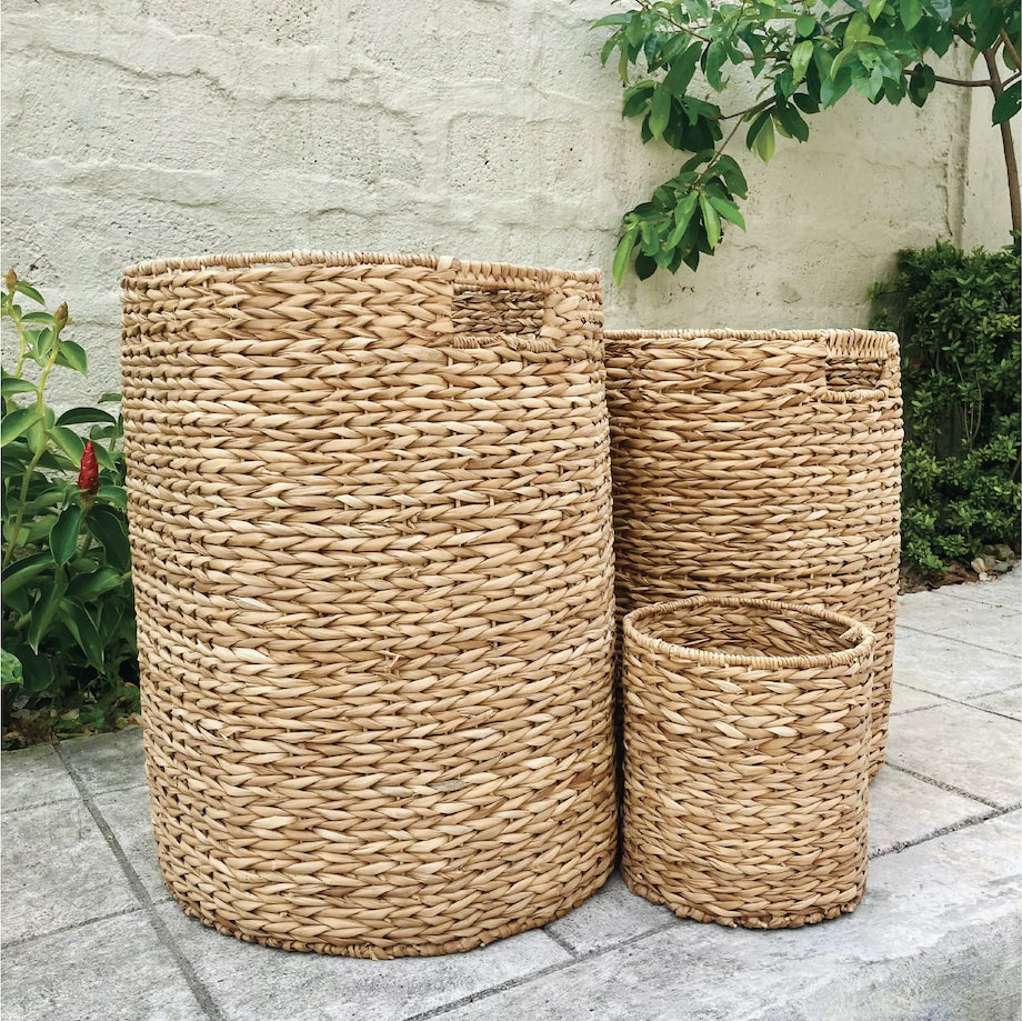 Set of 3 eco-friendly Gianna Basket Hampers, handcrafted from 100% natural plant fibers for stylish and sustainable storage; perfect for organizing laundry, toys, or household items in any room.