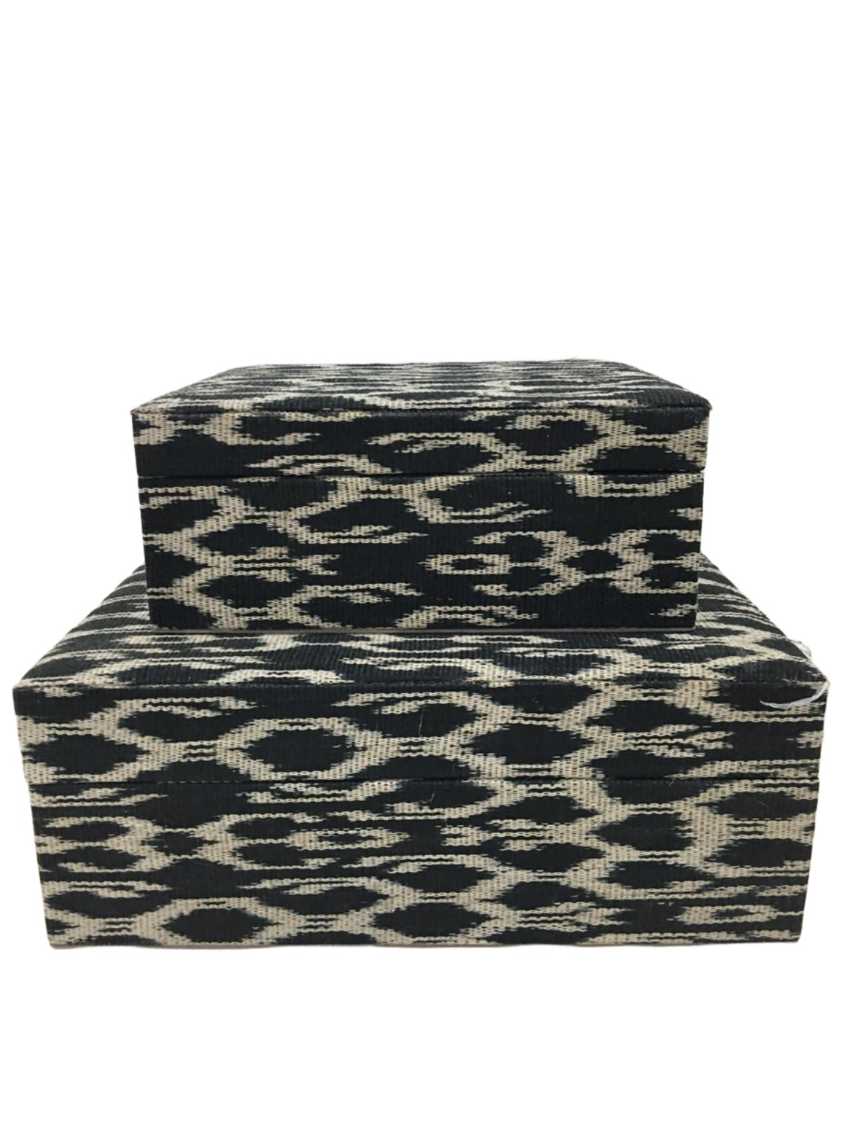 Eco-friendly Trixie Storage Boxes in Black Traditional made from 100% natural plant fiber and tinalak handloomed fabric by the T'boli tribe. Featuring a luxurious faux suede lining, these boxes offer stylish and sustainable storage solutions for your home.