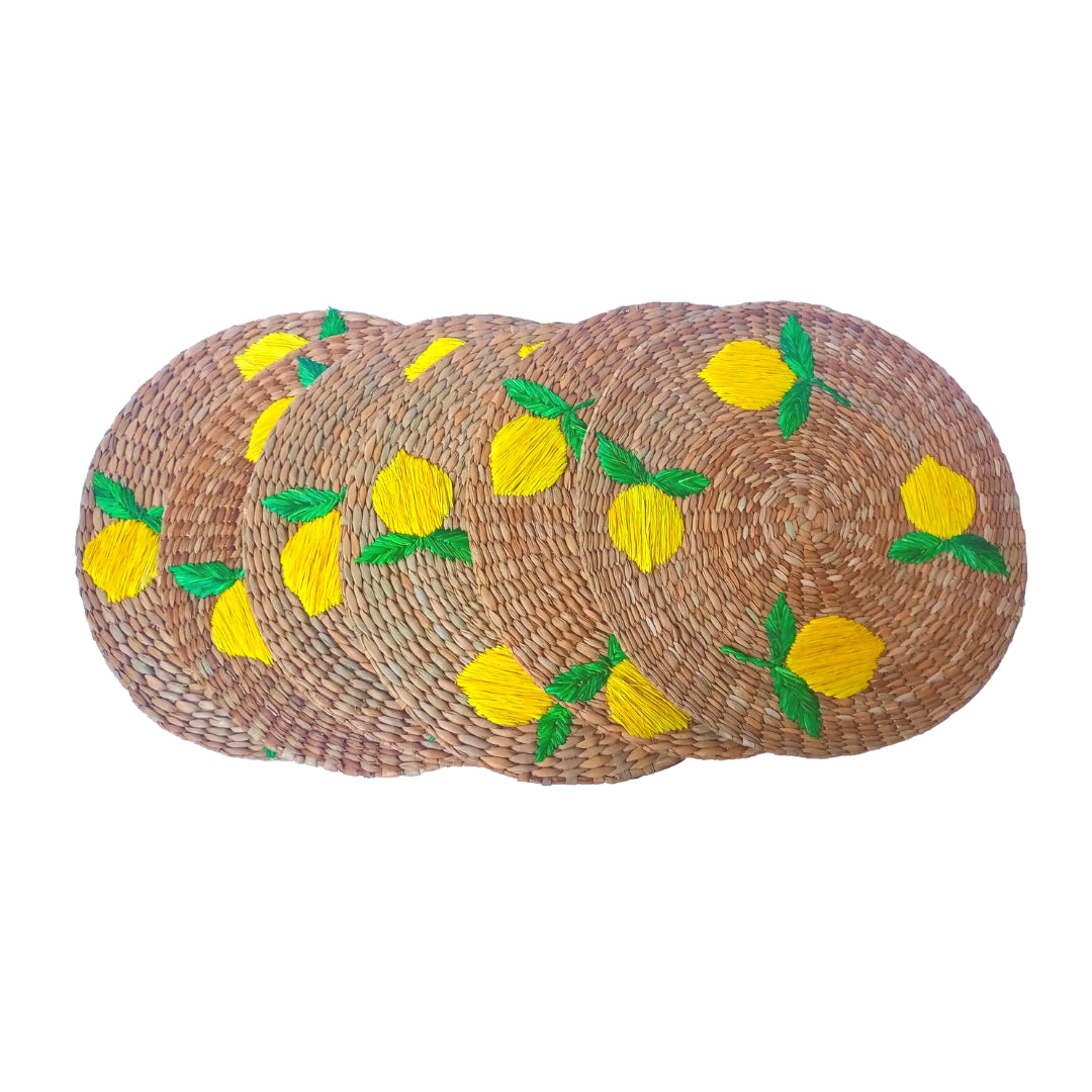 Lorenzo Lemons Seagrass Round Placemats set of 6, handcrafted from 100% natural plant fibers with embroidered designs of lemons and tropical leaves. Eco-friendly, durable, and stylish, perfect for enhancing your dining table decor.