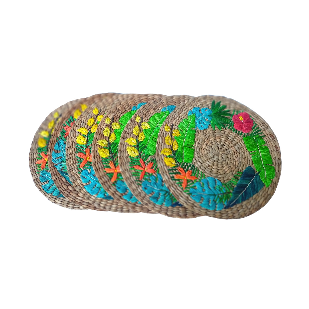 Lorenzo Tropical Seagrass Round Placemats set of 6, handcrafted from 100% natural plant fibers with embroidered designs of lemons and tropical leaves. Eco-friendly, durable, and stylish, perfect for enhancing your dining table decor.