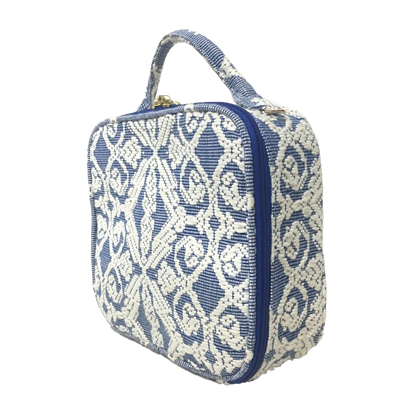 Dani Makeup Travel Bag, crafted with handwoven Abel Iloco fabric from the Ilocos region in the Philippines, featuring intricate nature-inspired patterns like stars, rivers, and florals. This makeup bag is spacious, ideal for organizing cosmetics and travel essentials, with 50% linen and 50% suede lining, and removable cotton straps. A tribute to Filipino heritage and sustainable craftsmanship. Spot clean and air dry to maintain its quality.