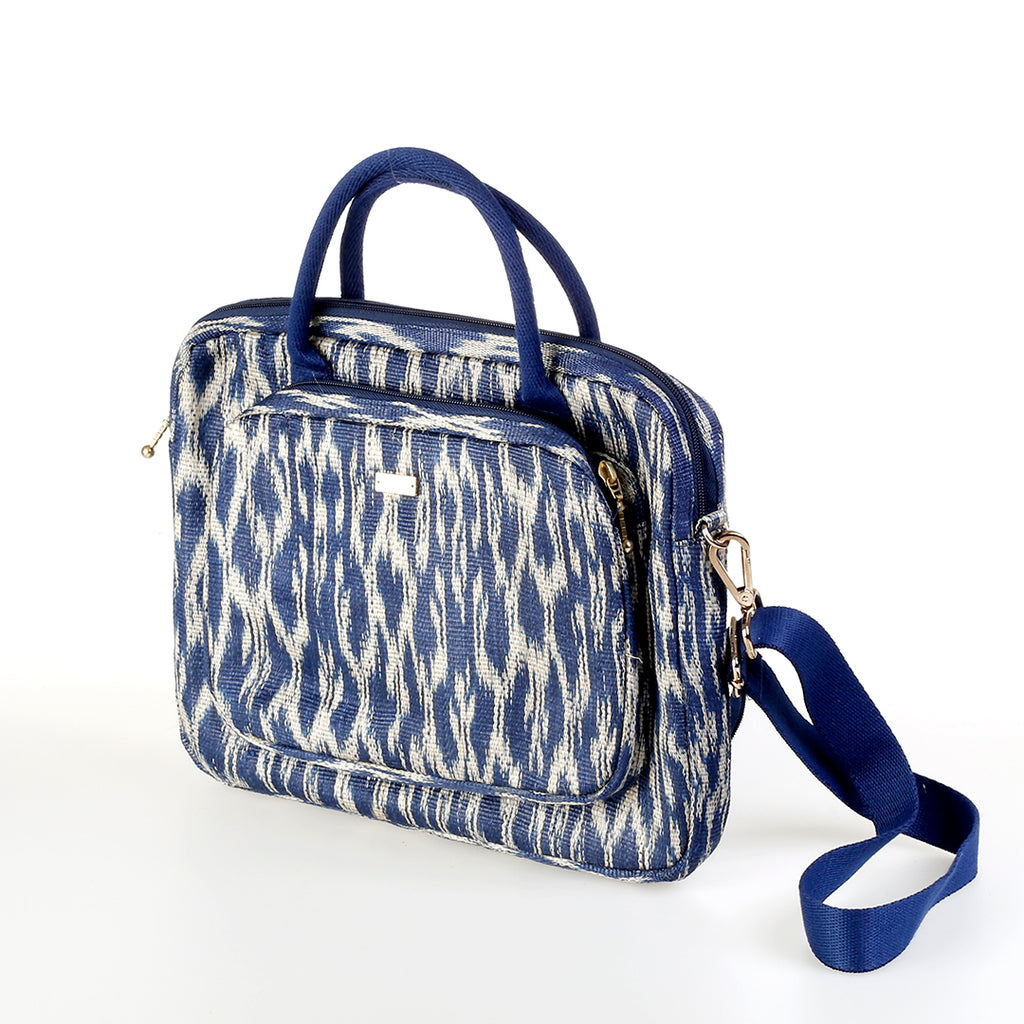 Deidre T'nalak Laptop Bag made from traditional T'nalak fabric, handwoven by the Tboli tribe in Mindanao using sustainable abaca plant fiber. This eco-friendly laptop bag accommodates devices up to 14 inches, blending heritage and modern utility with adjustable cotton straps. Durable 50% polyester and 50% cotton body. Spot clean for best care.