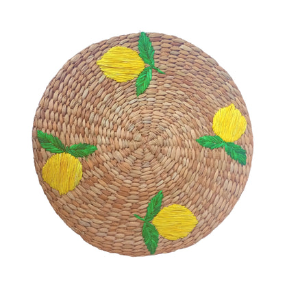 Lorenzo Lemons Seagrass Round Placemats set of 6, handcrafted from 100% natural plant fibers with embroidered designs of lemons and tropical leaves. Eco-friendly, durable, and stylish, perfect for enhancing your dining table decor.