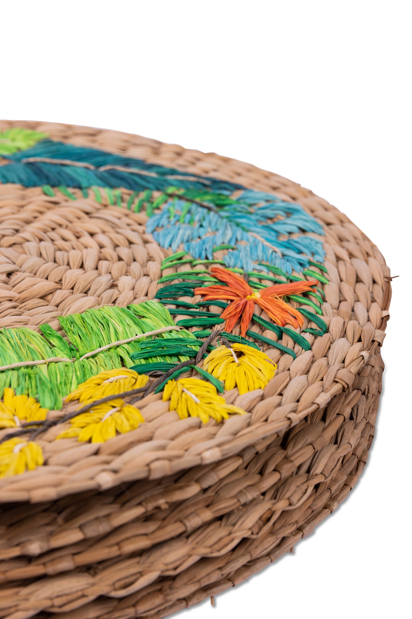 Lorenzo Tropical Seagrass Round Placemats set of 6, handcrafted from 100% natural plant fibers with embroidered designs of lemons and tropical leaves. Eco-friendly, durable, and stylish, perfect for enhancing your dining table decor.