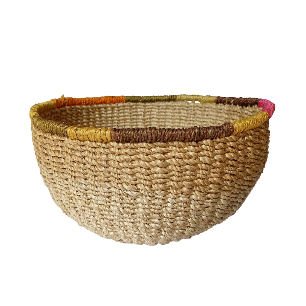 Mae Colorful Edge Fruit Bowl, handcrafted from 100% natural abaca with vibrant, dyed edges. Eco-friendly, versatile, and perfect for displaying fruit, serving snacks, or adding a decorative touch to any room.
