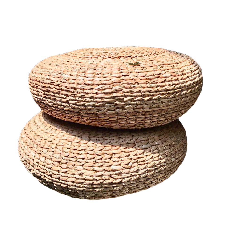 Carol Round Seagrass Pillow, a multifunctional home decor piece made from sustainably sourced seagrass, featuring a textured design that adds natural elegance to various styles like bohemian and modern coastal. Perfect for adding comfort to rattan benches or casual lounging on the floor, this eye-catching pillow enhances any living space while sparking conversations among guests. Care instructions include avoiding moisture and spot cleaning with a damp cloth.