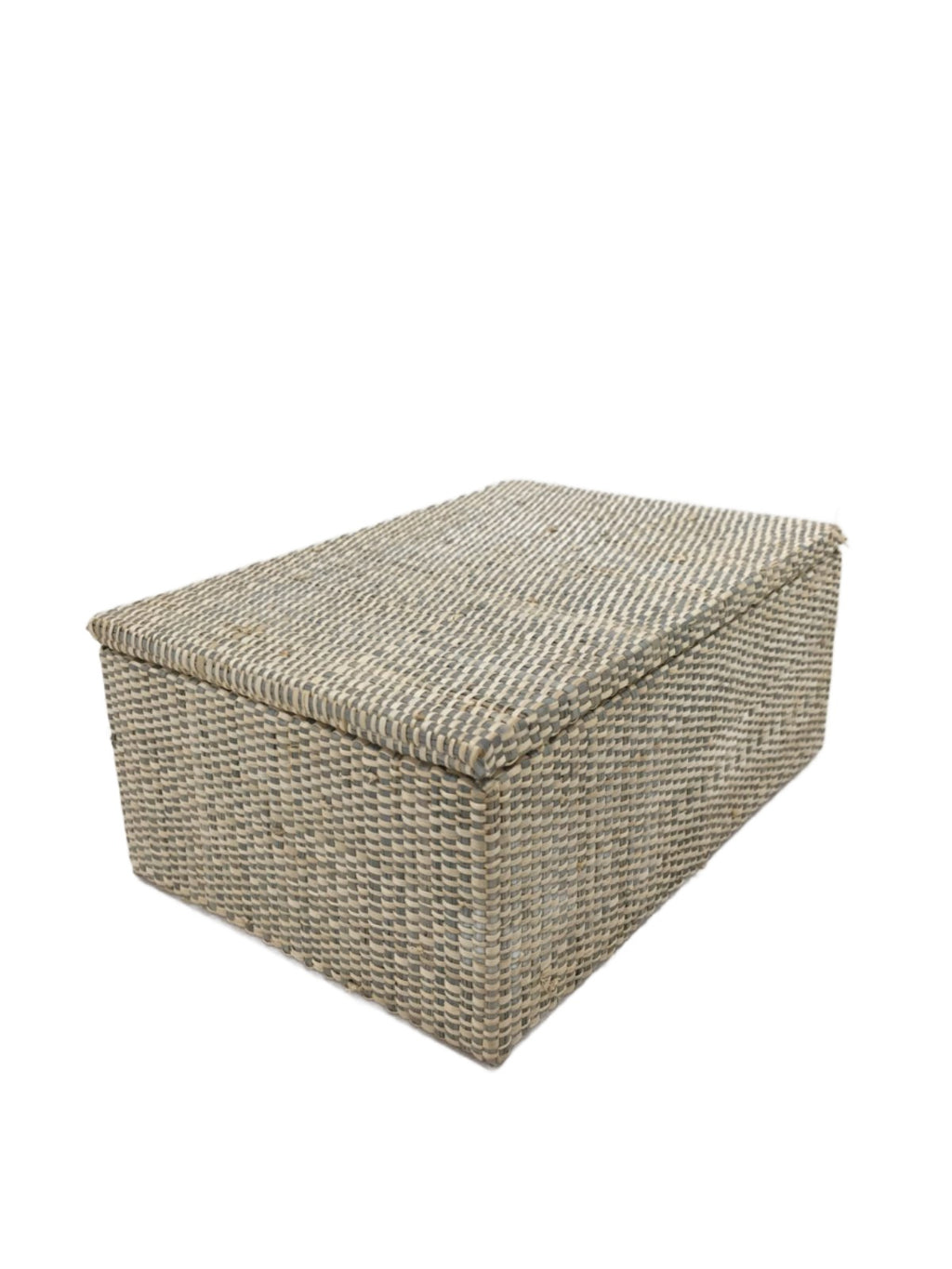 Cheska Jewelry Box in Grey, expertly crafted from 100% natural plant fiber using traditional raffia weaving techniques. This handwoven jewelry box combines elegance and functionality, making it perfect for organizing cherished jewelry, keepsakes, and knick-knacks. The soft grey hue adds a modern touch, complementing various decor styles from bohemian to contemporary. Ideal for sustainable living, this beautifully crafted jewelry box showcases artisanal skill while maintaining a timeless design. Care instruc