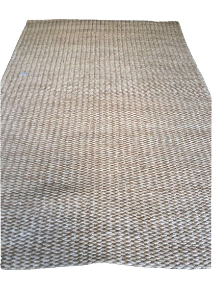 Elle Area Rug made from 100% natural plant fiber, perfect for adding texture and warmth to living rooms, bedrooms, and dining areas. Eco-friendly and versatile, it enhances a variety of home decor styles.