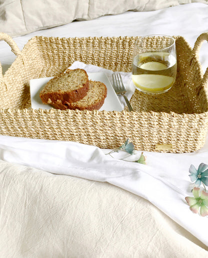 Elevate your home organization with the Stephanie Trays Set of 2. Handwoven from 100% natural plant fiber, these eco-friendly trays offer chic and sustainable storage solutions for any room, enhancing your decor with natural elegance.