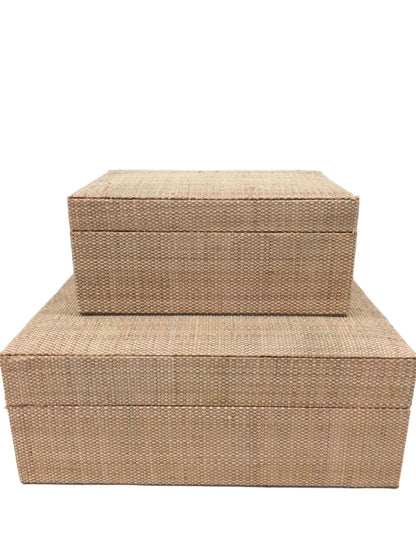 Organize in style with the Sophia Simple Storage Boxes Set of 2. Made from 100% natural plant fiber and lined with luxurious faux suede, these eco-friendly boxes blend sustainability with elegance for a tidy, chic space.