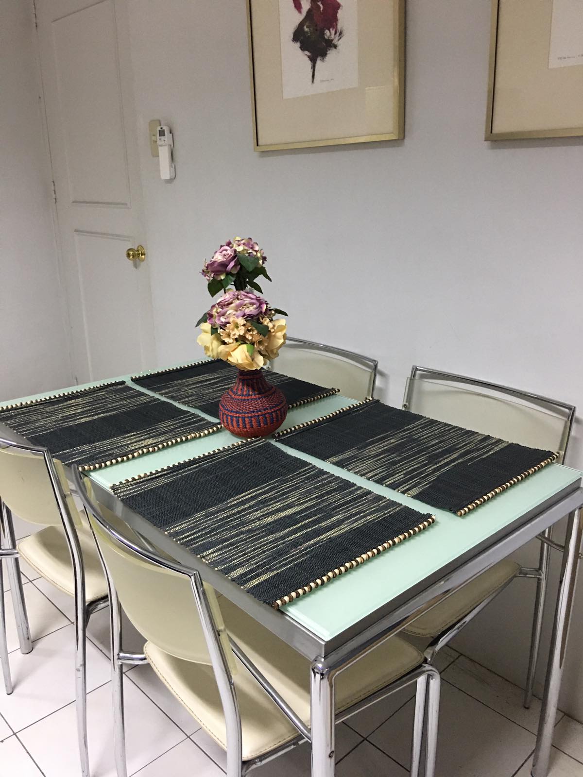 Abi Table Runner and Placemat Set of 6 in Black Ombre, handcrafted from 100% natural plant fiber, featuring a sleek and sustainable design.