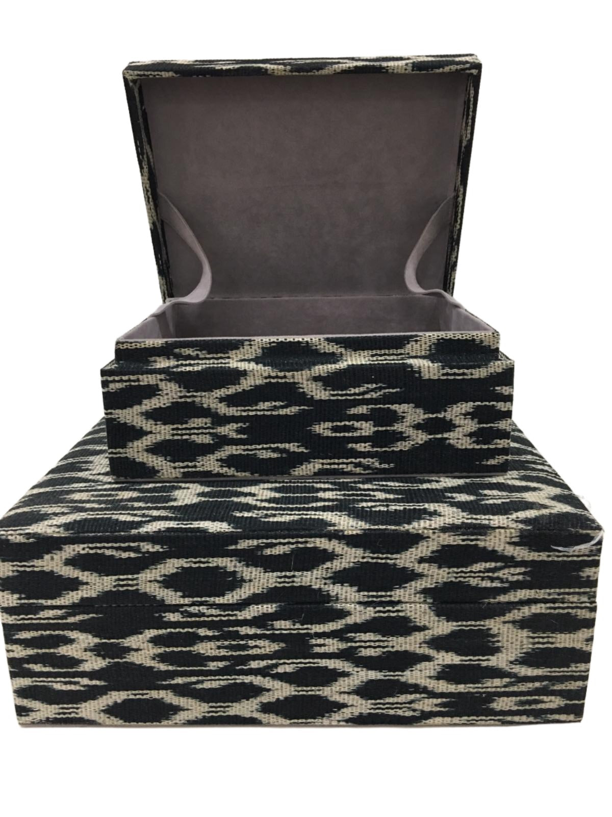 Eco-friendly Trixie Storage Boxes Black Traditional made from 100% natural plant fiber and tinalak handloomed fabric by the T'boli tribe. Featuring a luxurious faux suede lining, these boxes offer stylish and sustainable storage solutions for your home.