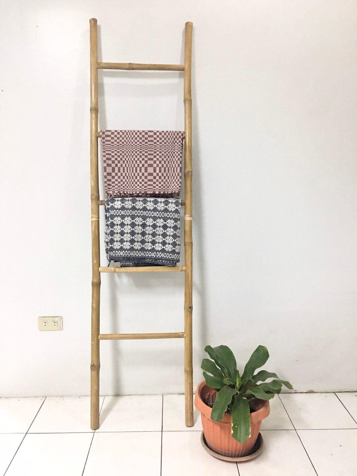 Veronica Bamboo Display Ladder crafted from sustainable bamboo, offering a multi-functional, eco-friendly storage solution. Perfect for towel racks, garment displays, and home decor, this elegant ladder adds a natural touch to any space.